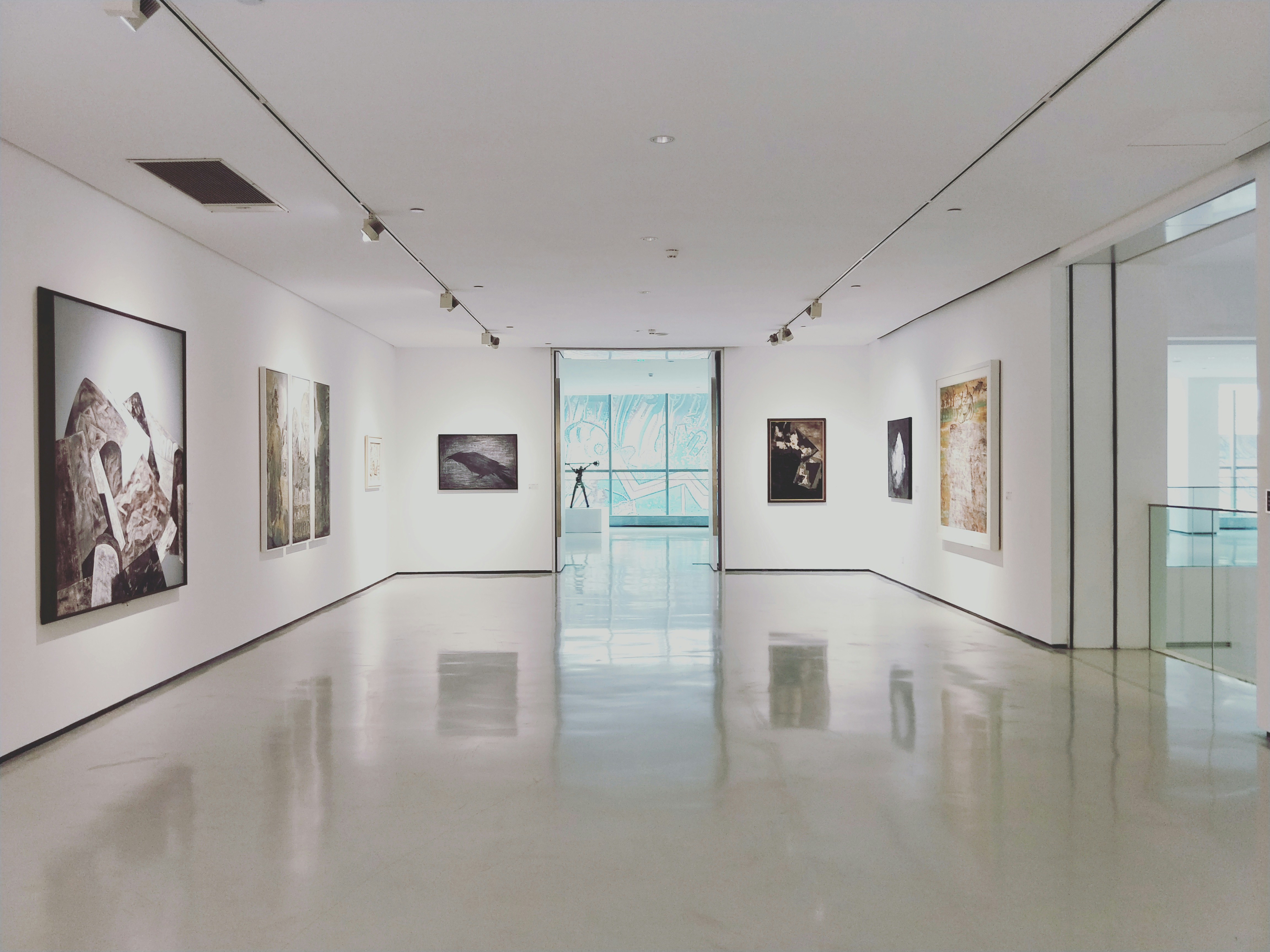 Gallery hallway with artwork displayed along the walls