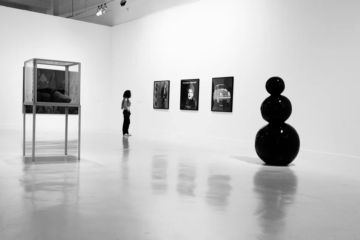 Gallery wall displaying multiple artworks in a curated arrangement