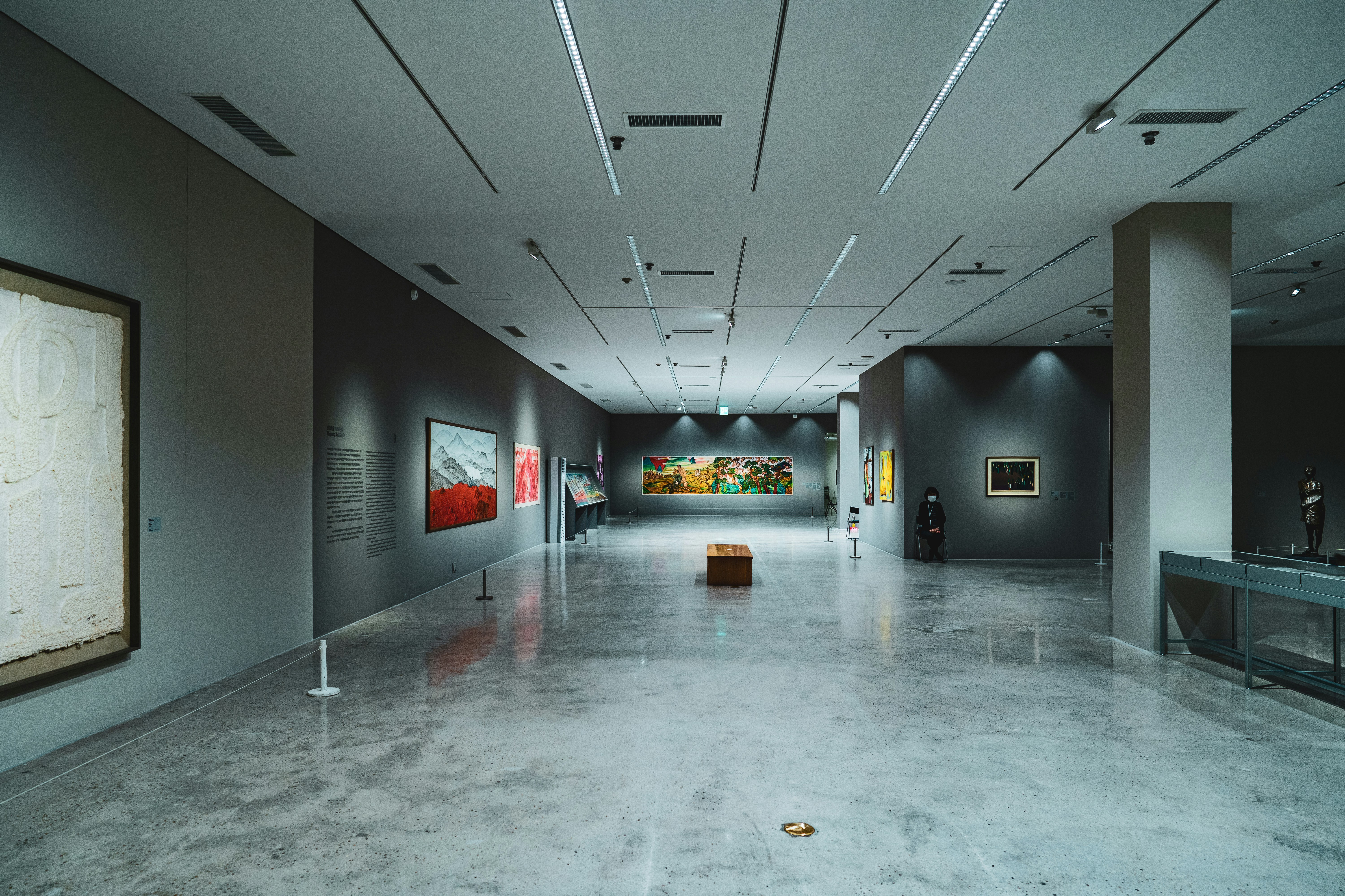 Gallery space with artwork displayed on walls